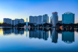 city skyline across body of water during daytime
