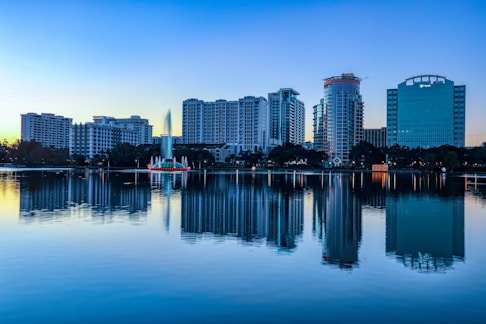 city skyline across body of water during daytime