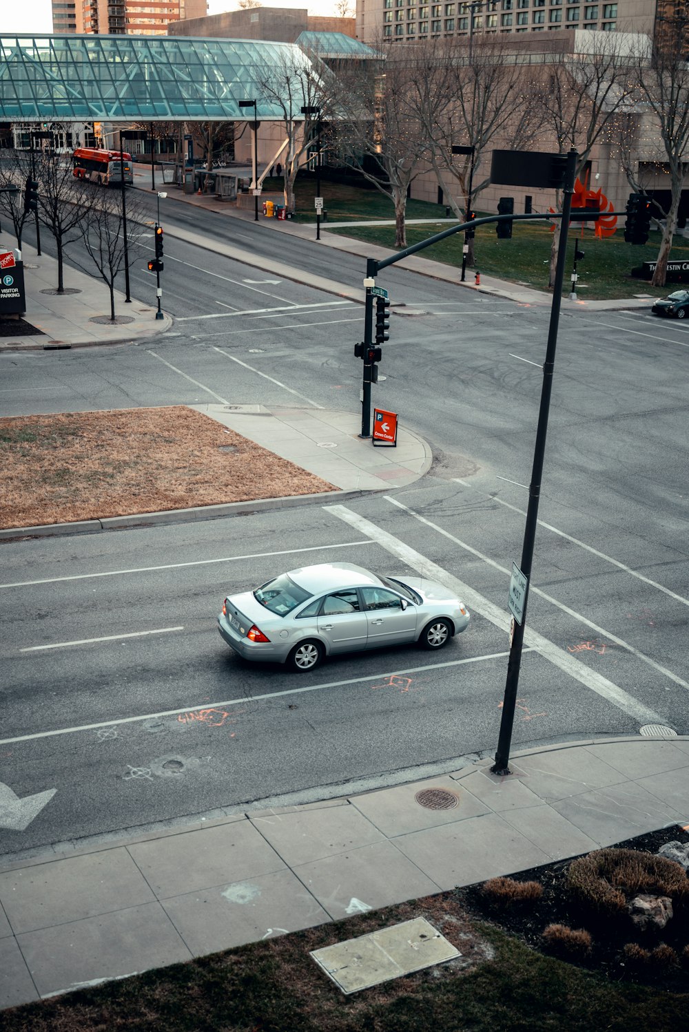 silver sedan on road during daytime