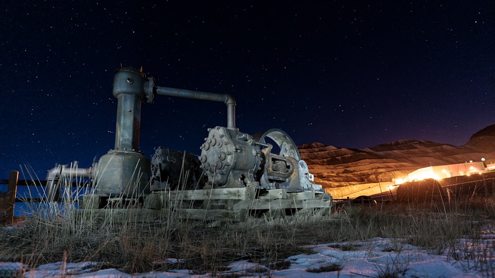 gray and black tank on brown field during night time