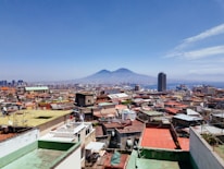 A panoramic view from the finca showing volcanoes and the city in the distance at sunrise.