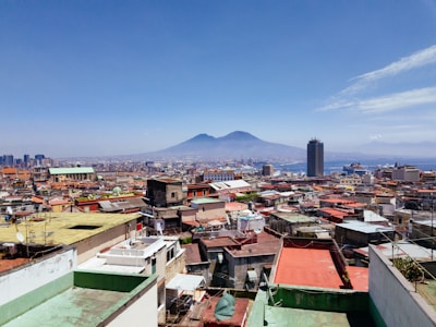 A panoramic view from the finca showing volcanoes and the city in the distance at sunrise.