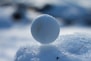 white round ornament on white surface