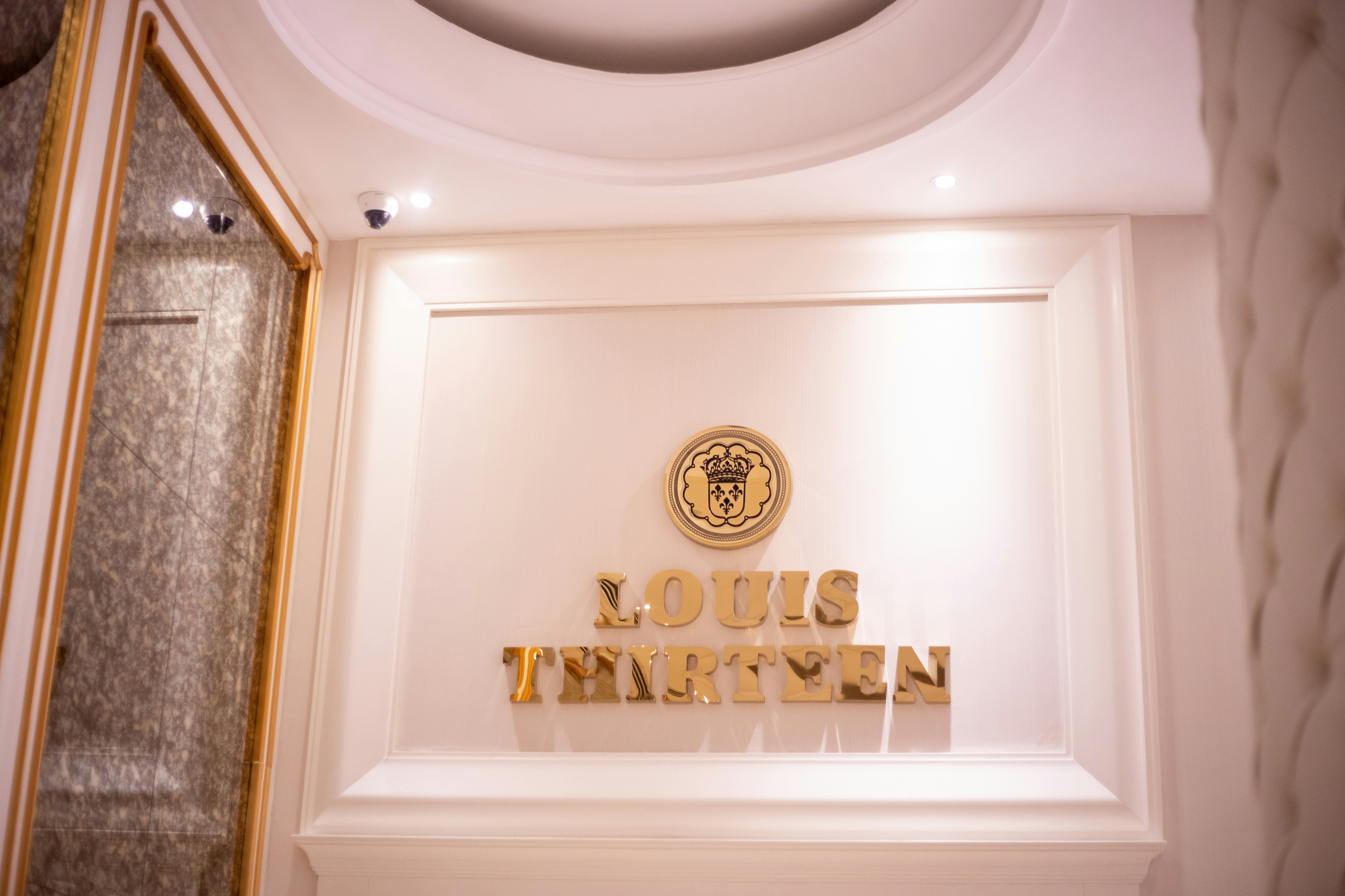 Gold and white wall decor luxury travel office