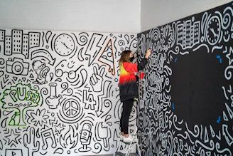 A skilled craftsman carefully painting a cozy living room wall in a Liverpool home.