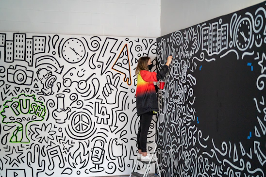 A skilled craftsman carefully painting a cozy living room wall in a Liverpool home.