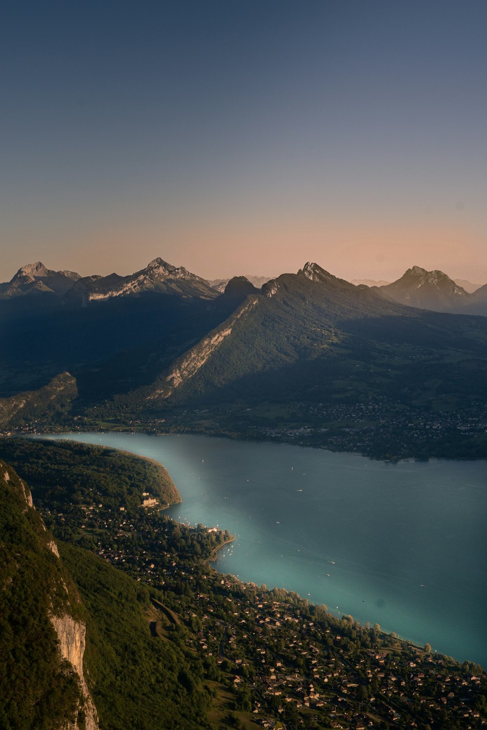 lake in the middle of mountains during daytime