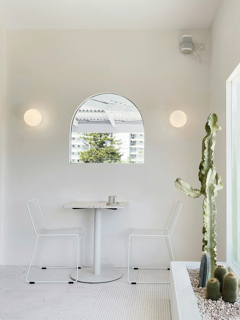 white wooden table with chairs