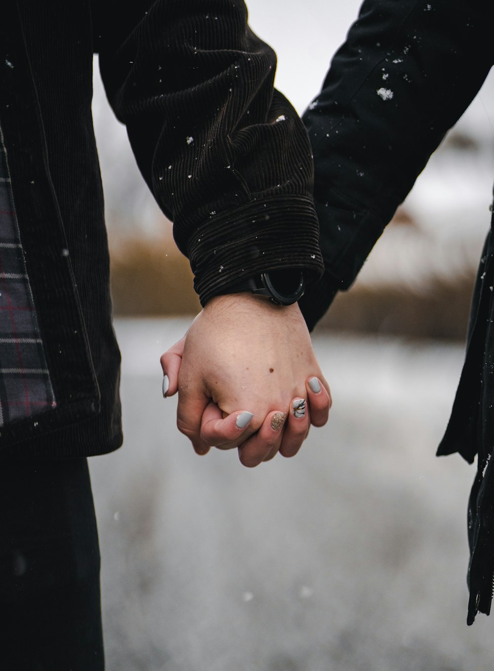 man and woman holding hands