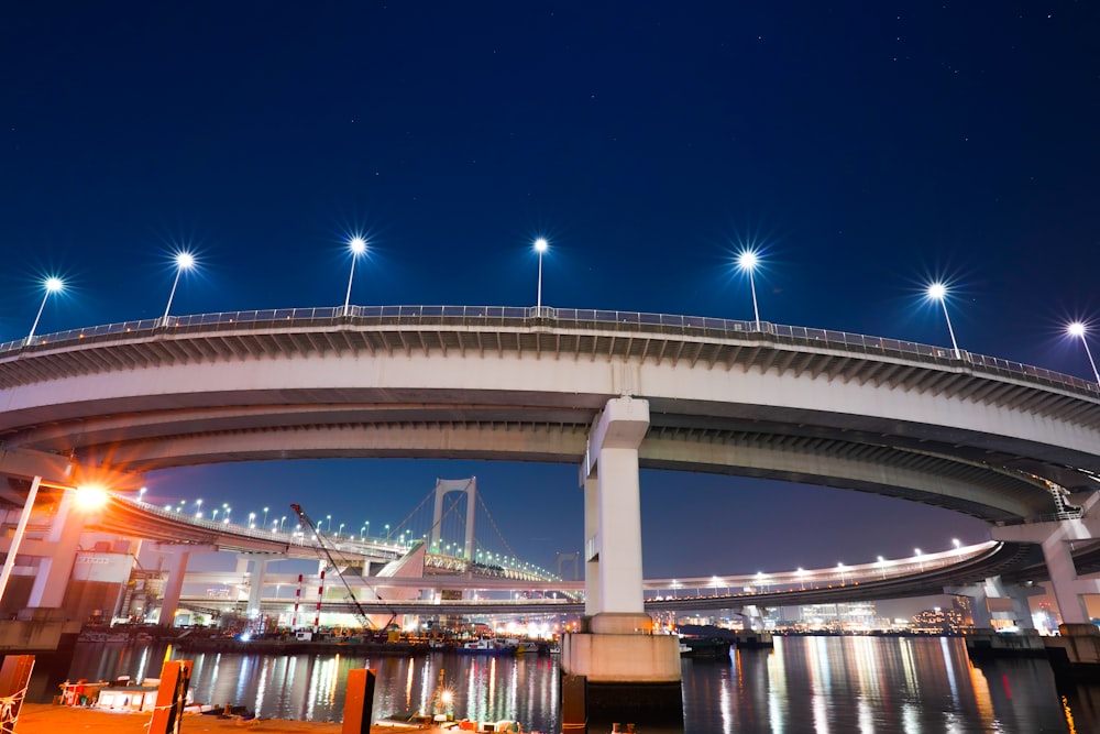 white bridge with lights during night time