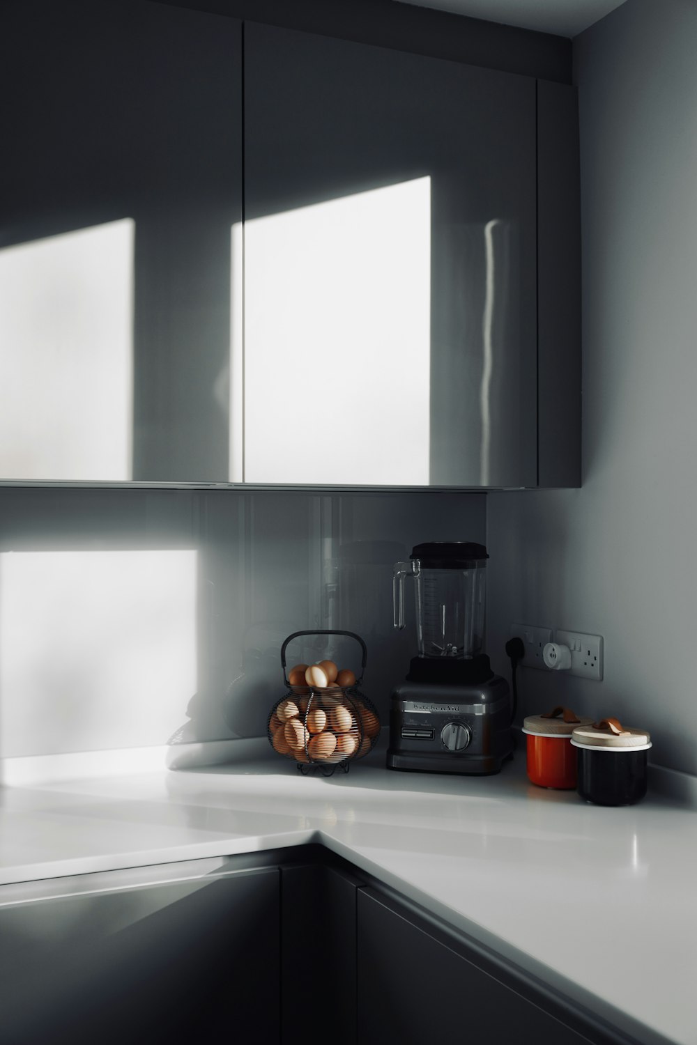 black and white coffee maker on white table