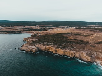 Aerial view of a remote coastal area with limited connectivity.