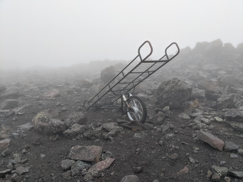 black and gray bicycle on rocky ground