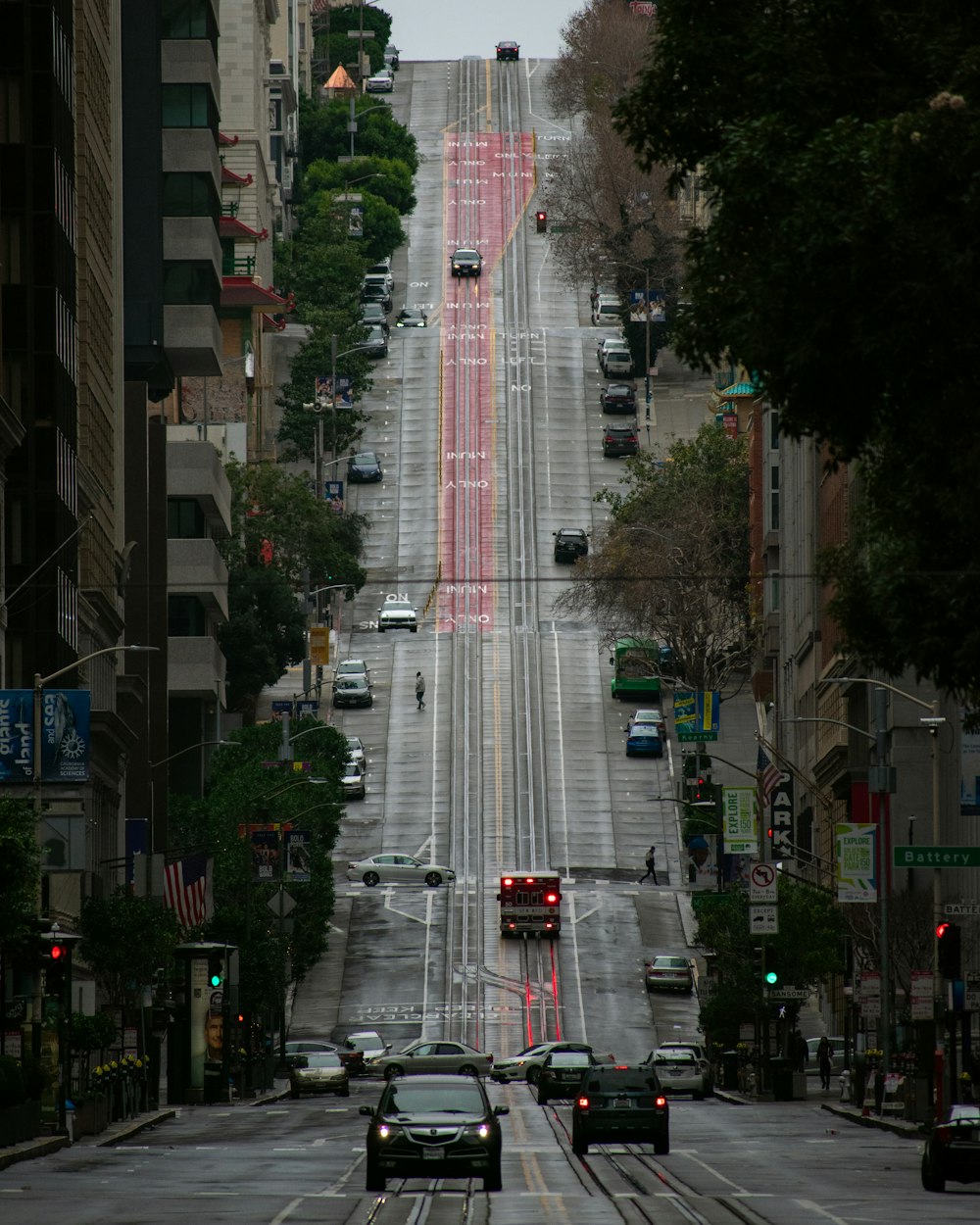 cars on road near high rise building during daytime