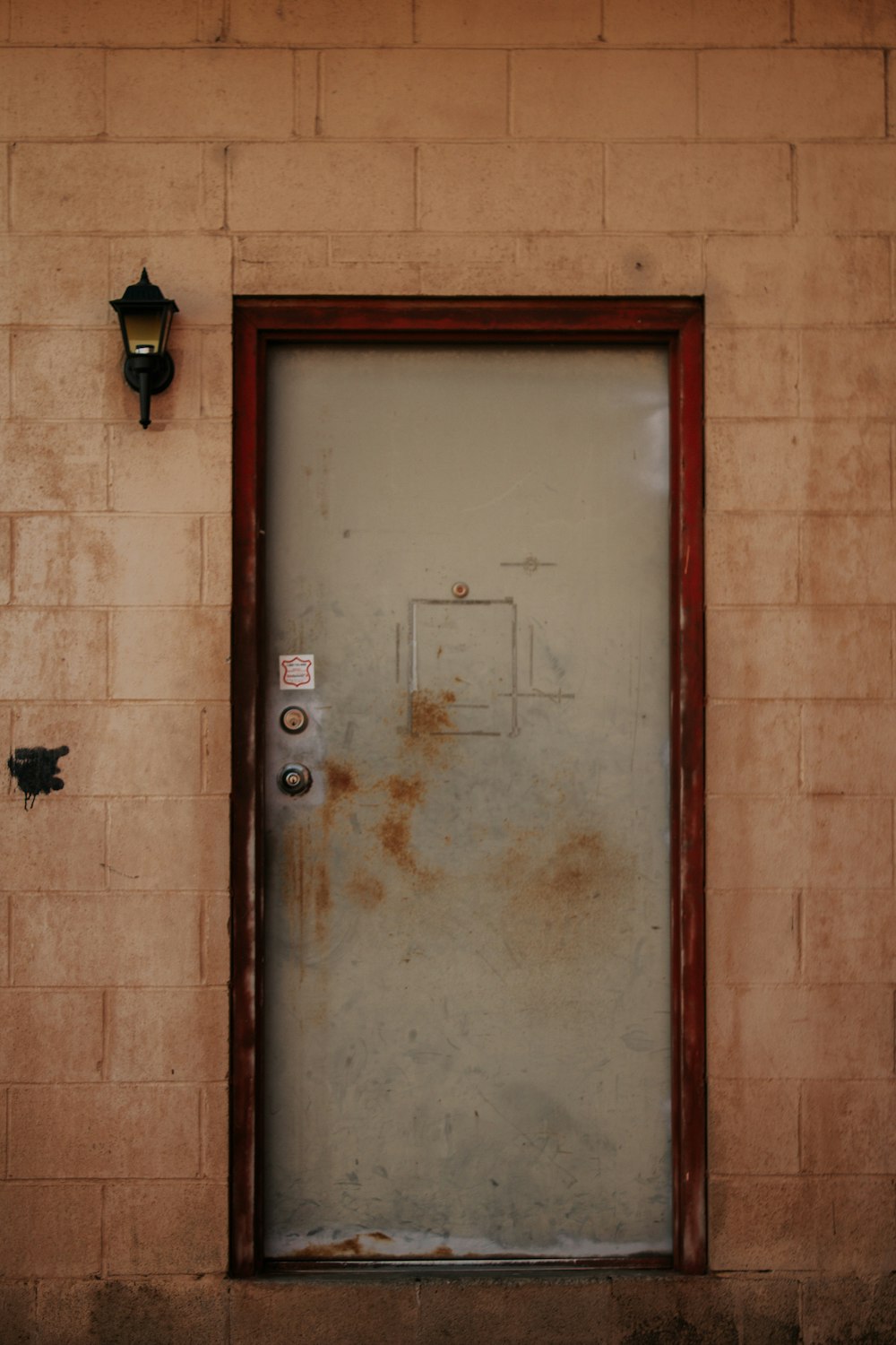 brown wooden door with black steel door knob