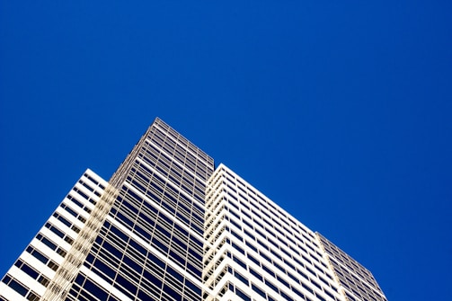 A completed building with a clear blue sky backdrop.