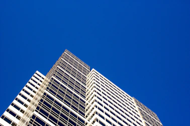 City hall building with a clear blue sky, symbolizing smooth permit processing.
