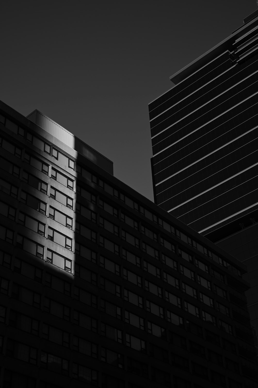 grayscale photo of high rise building