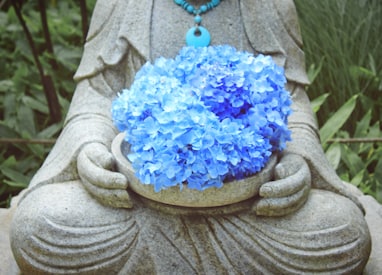 blue flowers on brown round pot