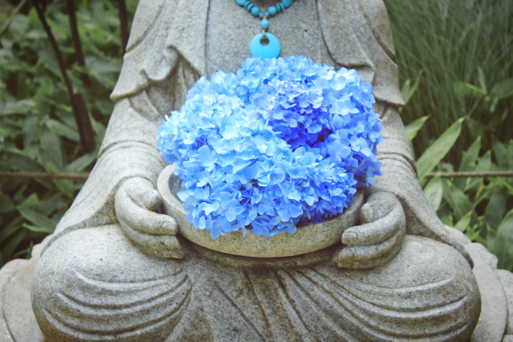 blue flowers on brown round pot