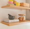 brown wooden shelf with assorted items