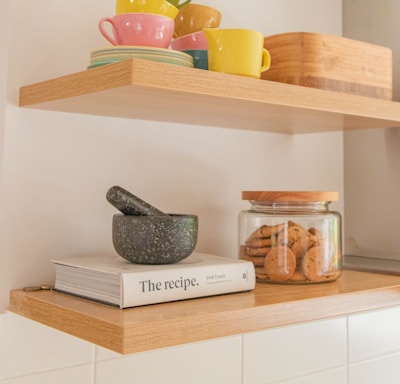 brown wooden shelf with assorted items