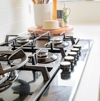 black and white chess pieces on black and silver gas stove