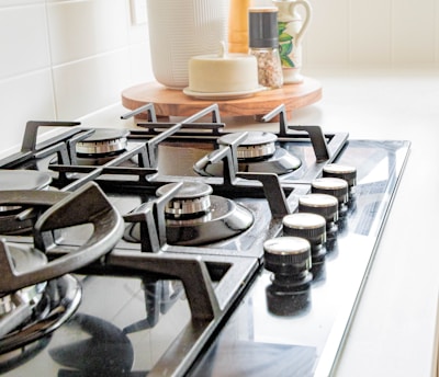 black and white chess pieces on black and silver gas stove