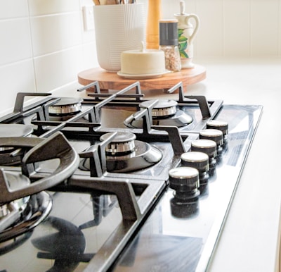 black and white chess pieces on black and silver gas stove