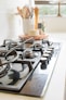 black and white chess pieces on black and silver gas stove