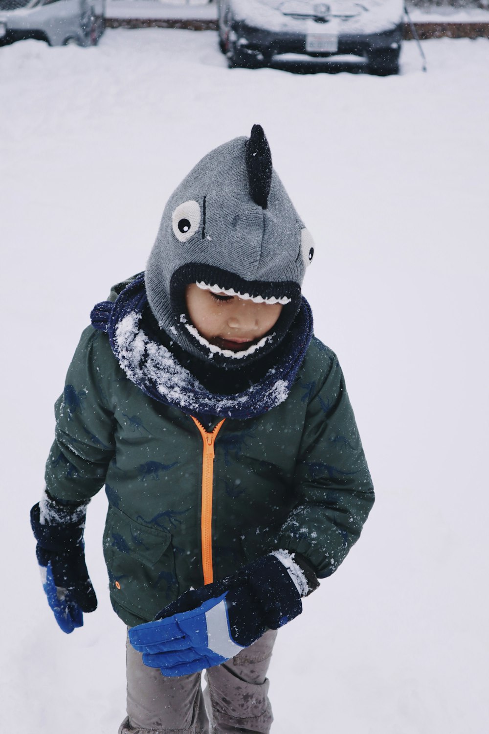 person in black winter coat and gray knit cap