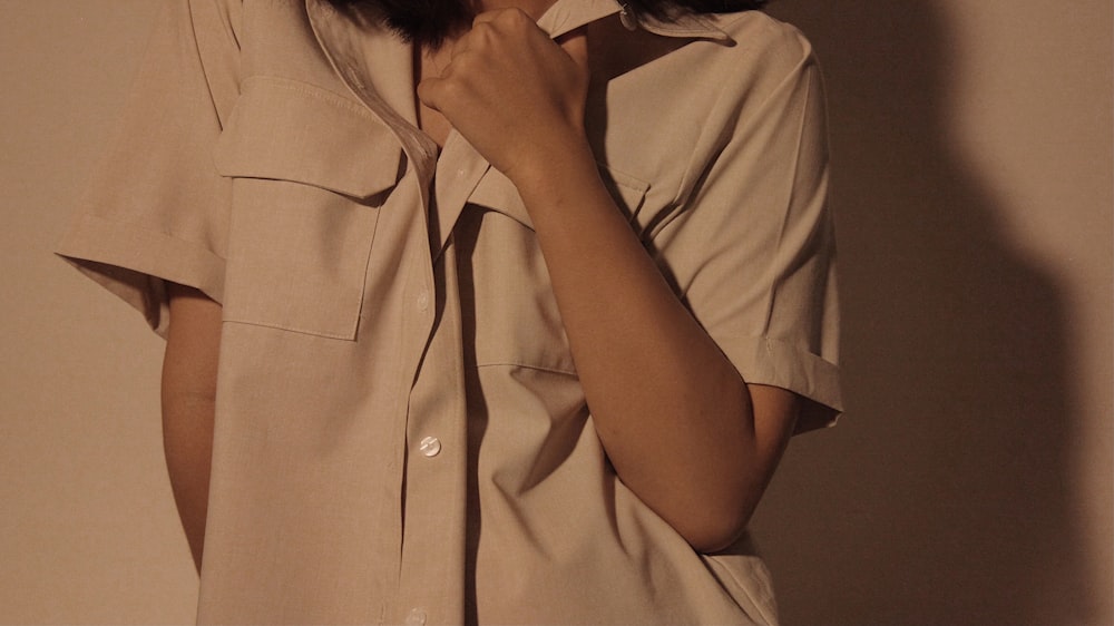 woman in white button up shirt