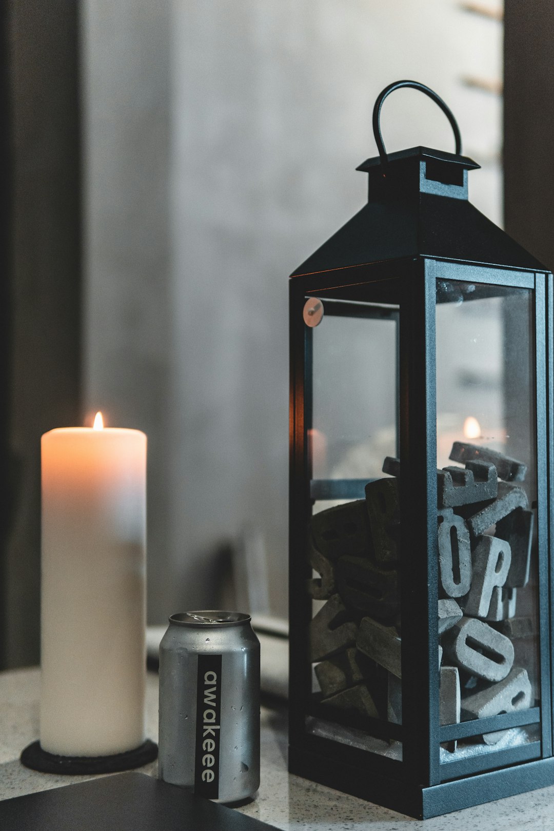 white candles on black candle holder