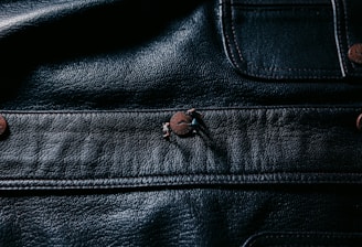 black leather textile with silver stud earring