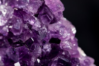 purple gemstone in close up photography