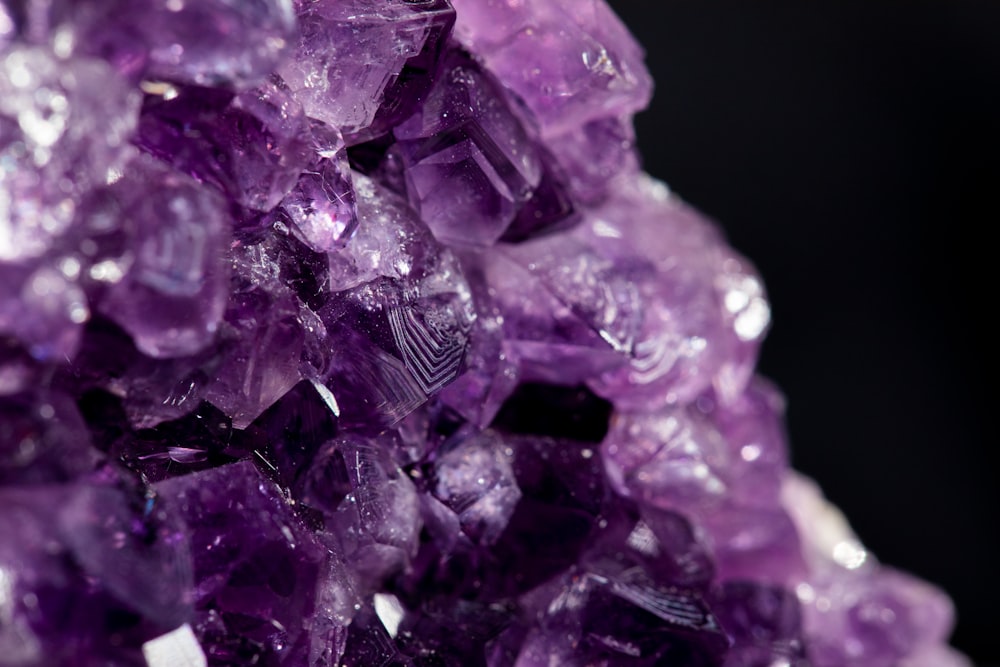 purple gemstone in close up photography