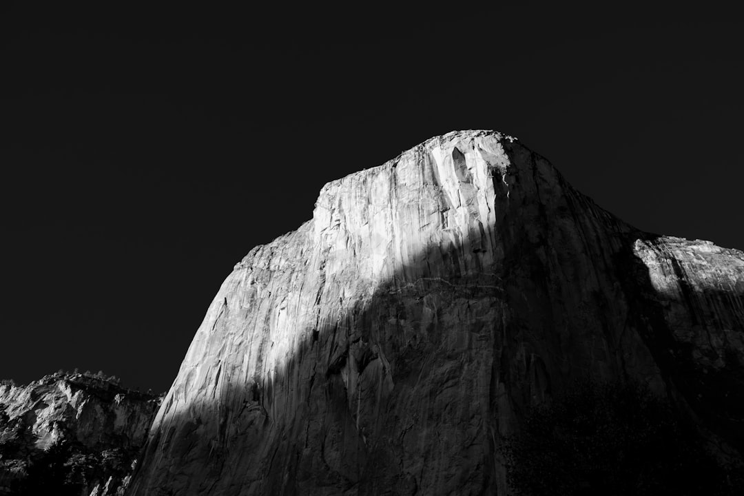 grayscale photo of rocky mountain