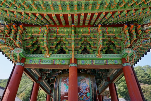 red green and brown wooden bench