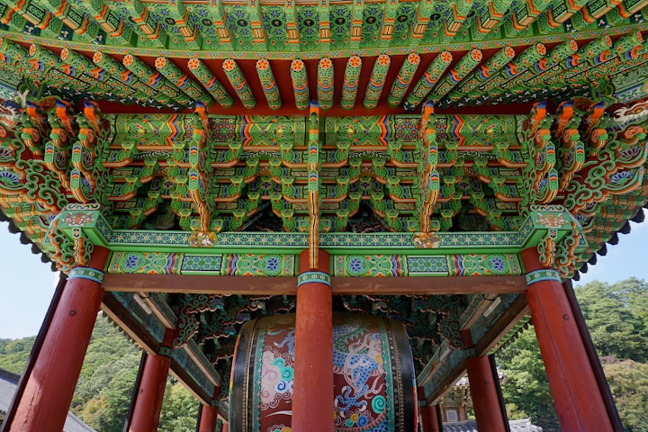 red green and brown wooden bench