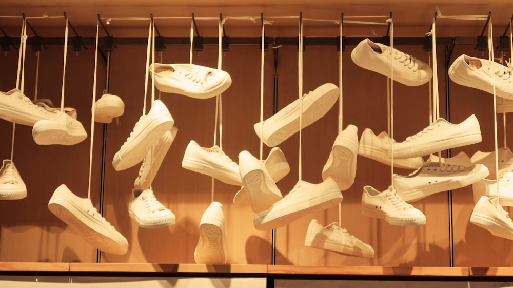 white leather shoes on rack