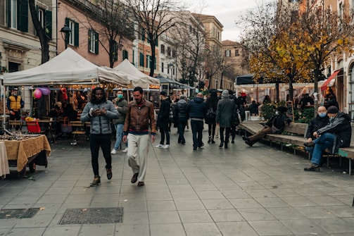 people walking on sidewalk during daytime