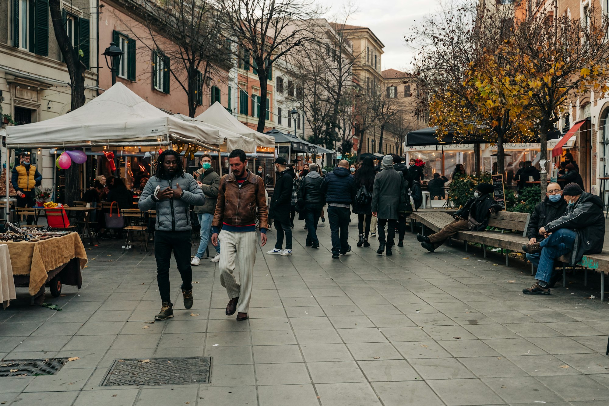 People strolling and hanging out in the trendy Pigneto neighbourhood in Rome, Italy