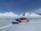 Image of a hunter unloading gear from a small plane on a remote Alaskan airstrip.