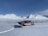 Image of a hunter unloading gear from a small plane on a remote Alaskan airstrip.