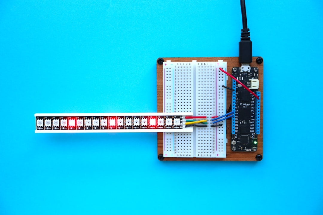 a breadboard with a thermometer and a soldering tool, Meadow F7 Micro