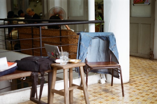 clear drinking glass on brown wooden table