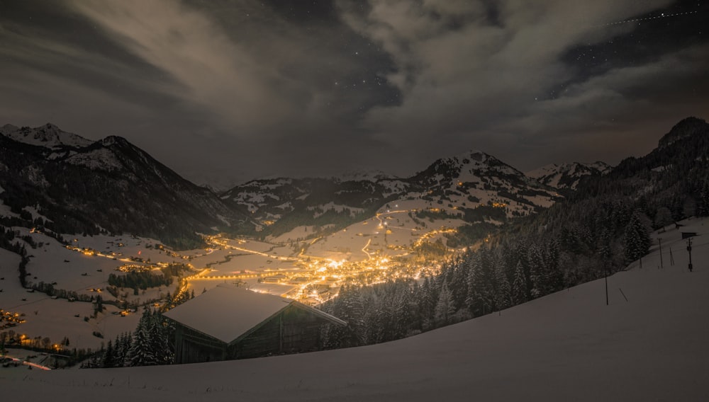 snow covered mountain under cloudy sky during daytime