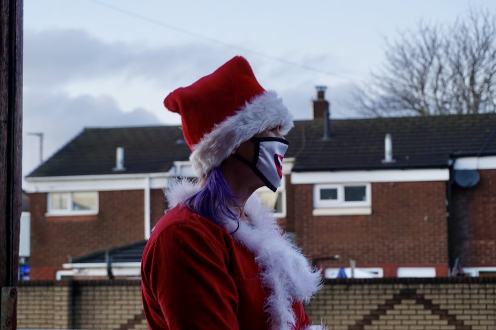 woman in red santa hat and red coat