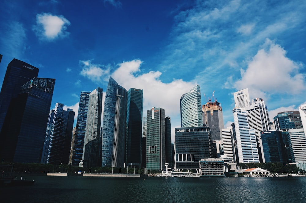 city skyline across body of water during daytime