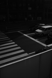 white car on pedestrian lane